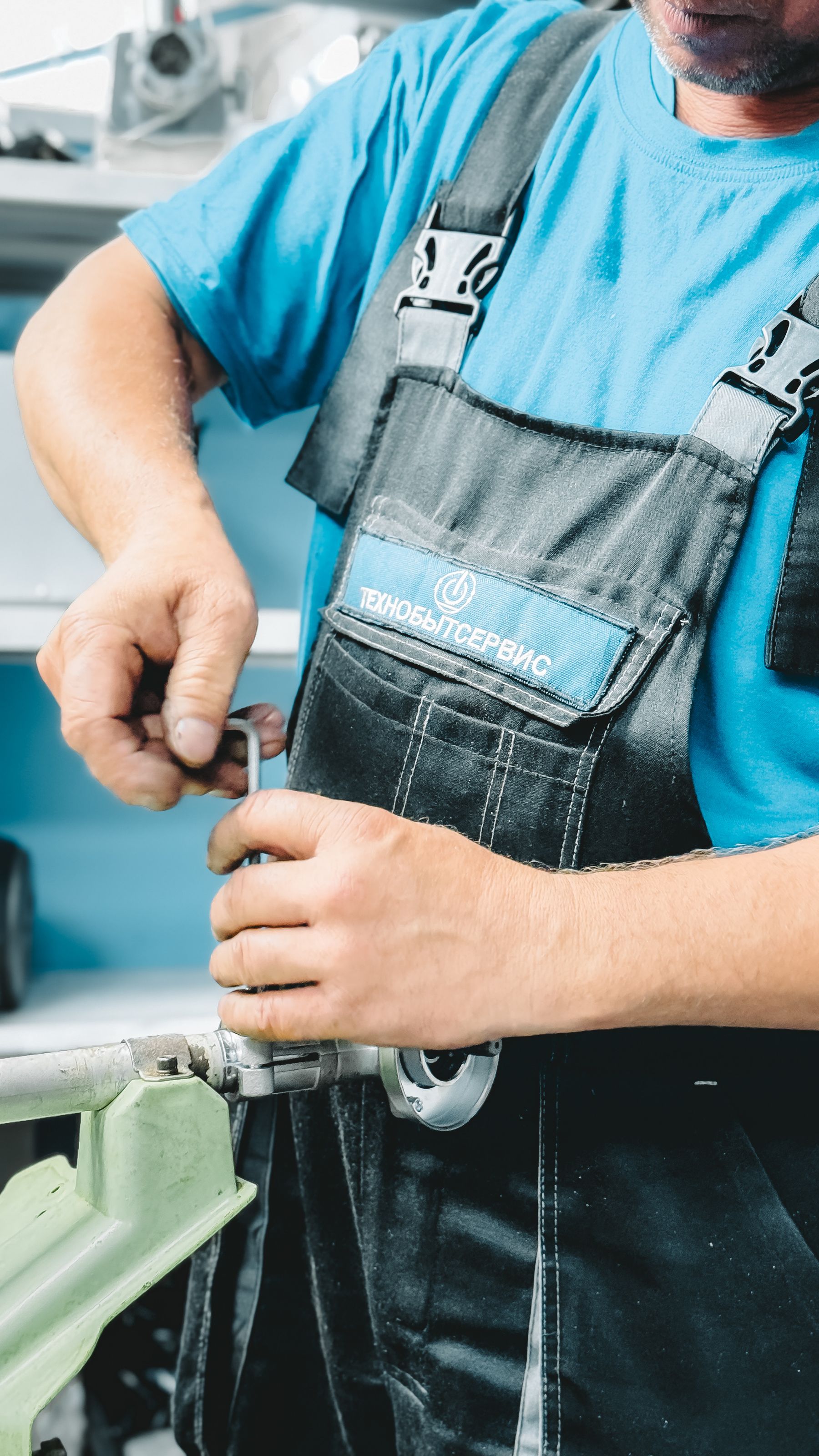 Professional plumber working on pipes